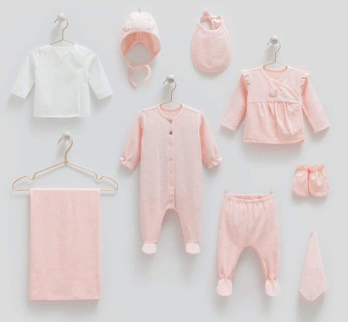 Baby hospital set including a onesie, shirt, pants, bib, hat, mittens and a blanket.