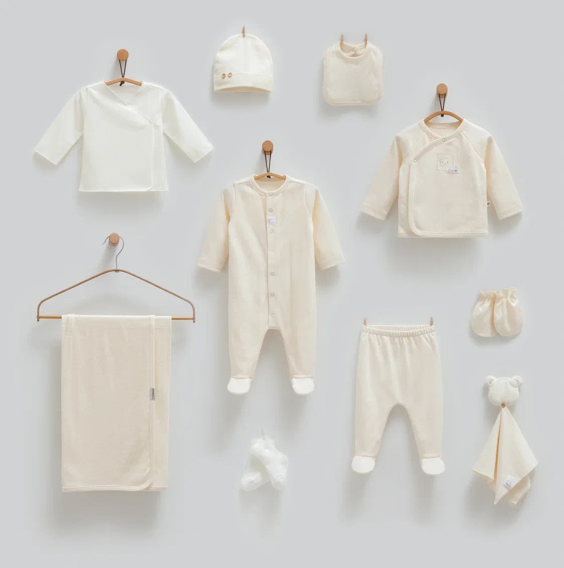 Baby 100% cotton hospital set including an overall, shirt, pants, bib, hat, mittens, socks and a blanket in Beirut, Lebanon.