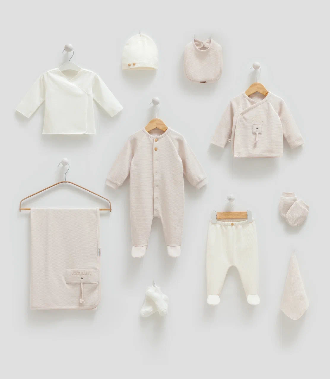Baby 100% cotton hospital set including an overall, shirt, pants, bib, hat, mittens, socks and a blanket in Beirut, Lebanon.