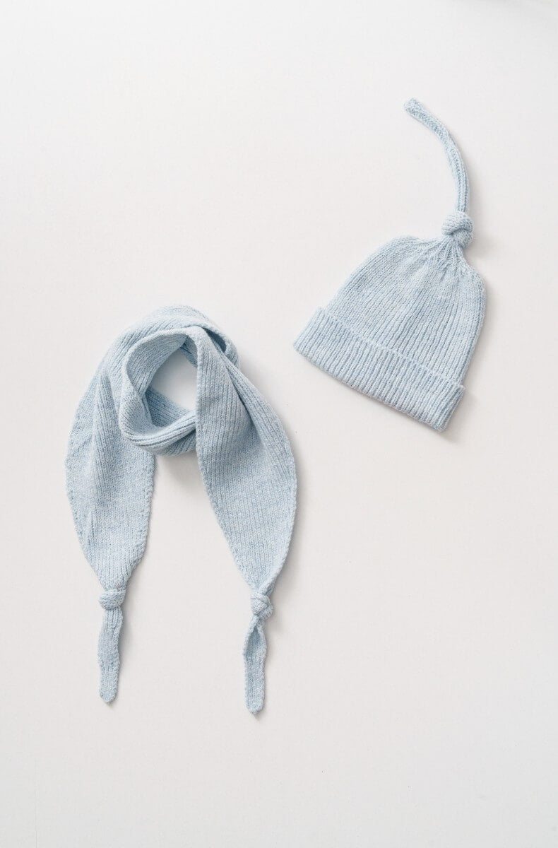 Knitted baby blue hat with matching scarf