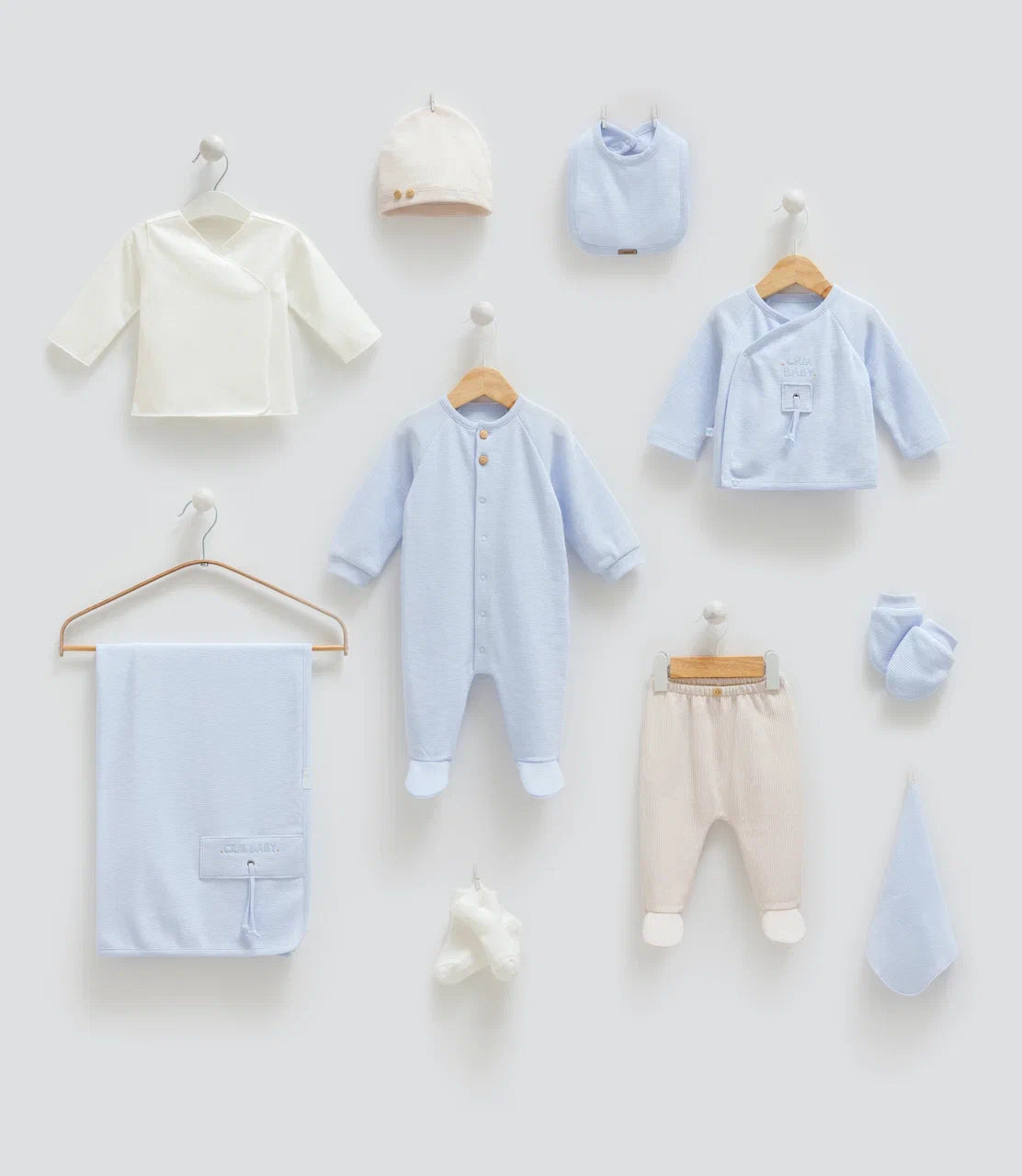 Baby 100% cotton hospital set including an overall, shirt, pants, bib, hat, mittens, socks and a blanket in Beirut, Lebanon.