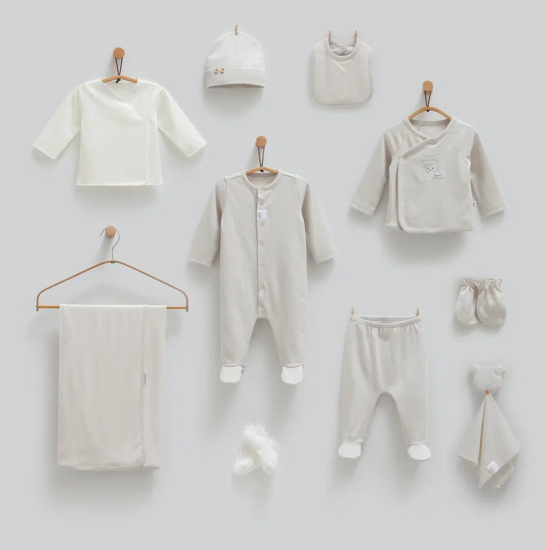 Baby 100% cotton hospital set including an overall, shirt, pants, bib, hat, mittens, socks and a blanket in Beirut, Lebanon.