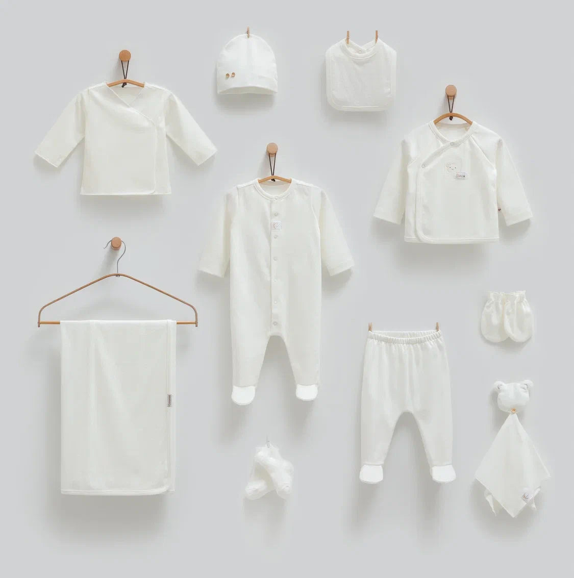 Baby 100% cotton hospital set including an overall, shirt, pants, bib, hat, mittens, socks and a blanket in Beirut, Lebanon.
