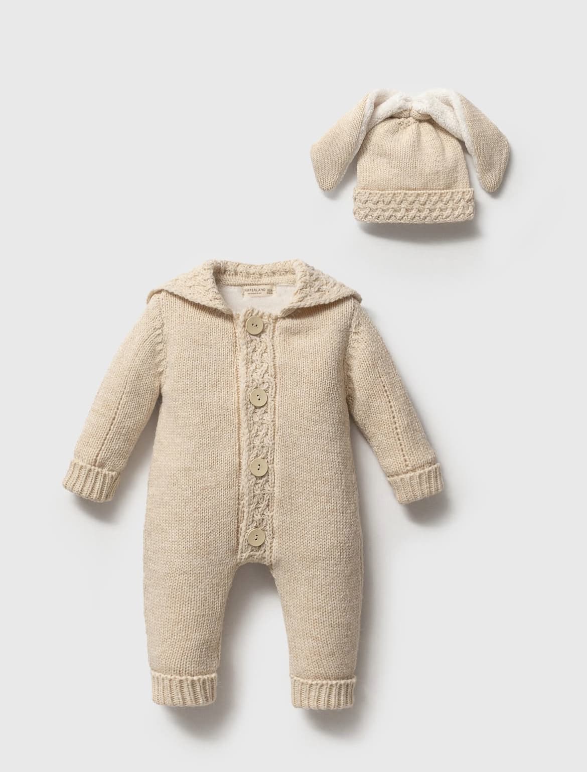 Beige baby overall with hood and matching hat on a light gray background