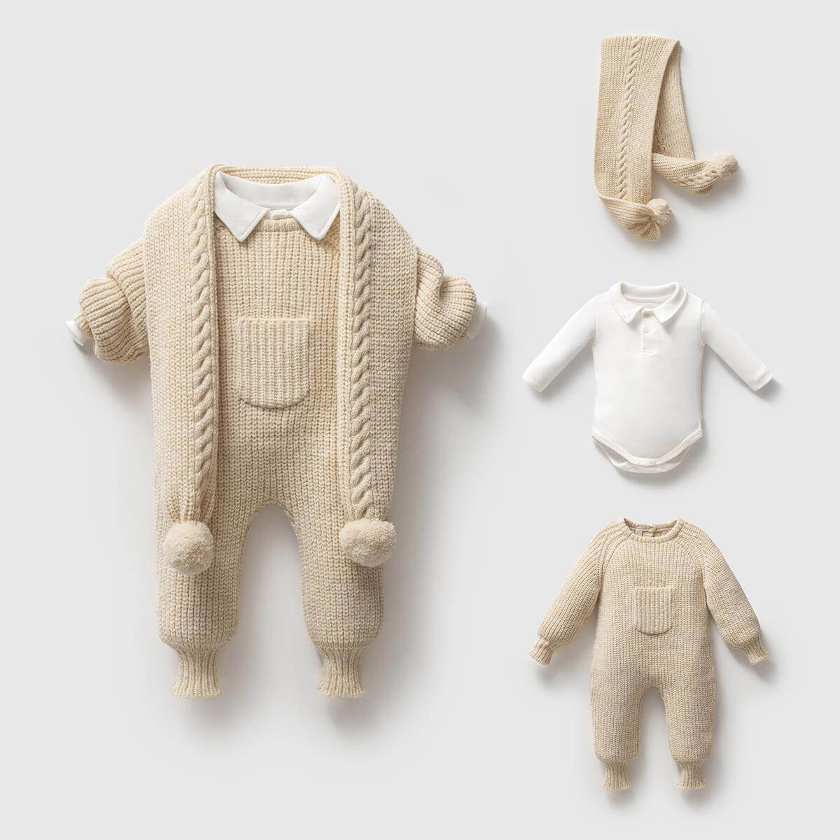 Knitted baby romper with a scarf and baby onesie on a light background