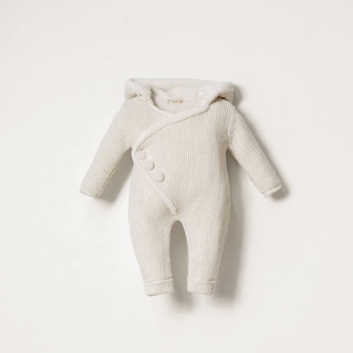Baby knit romper with hood on a white background