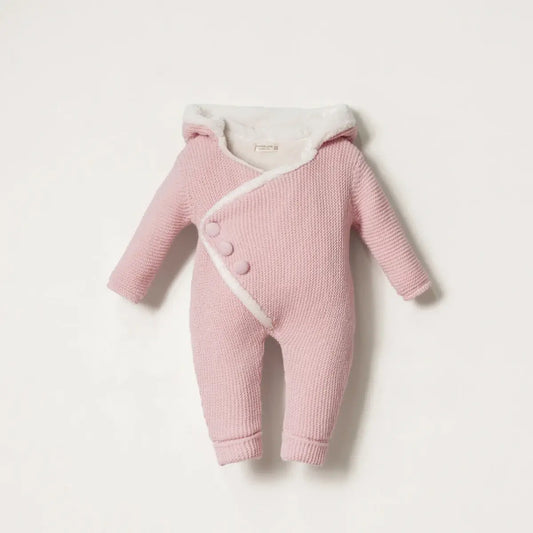 Pink baby romper with fur lining on a light pink background